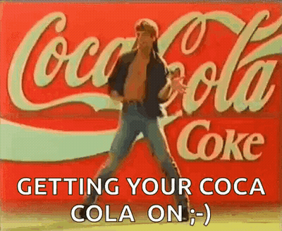 Man Dancing In Front Of Coca Cola Sign GIF