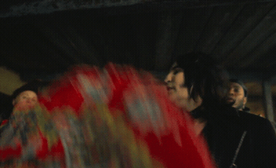 Man Dancing In Front Of Dick Tarp Sign GIF