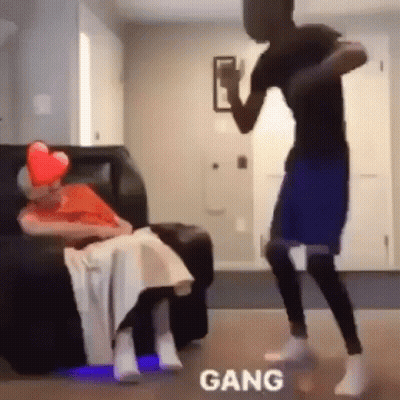 Man Dancing In Front Of Elderly Woman On Couch GIF