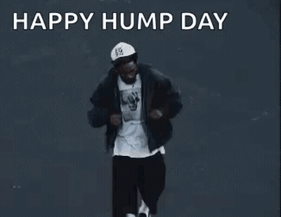 Man Dancing In Front Of Happy Hump Day Sign GIF