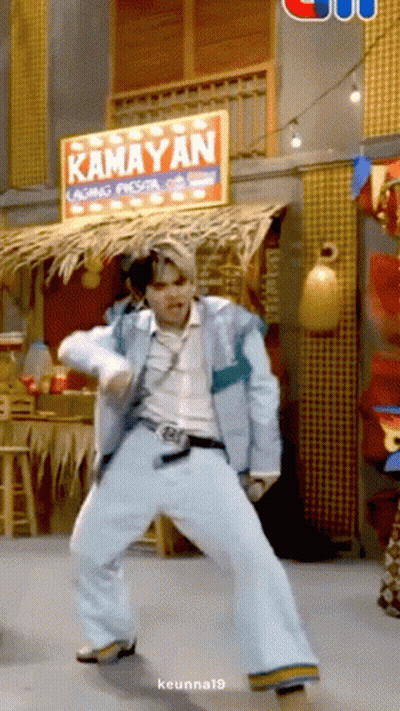 Man Dancing In Front Of Kamayan Sign GIF
