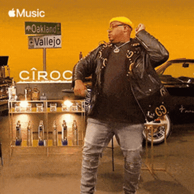 Man Dancing In Front Of Oakland Vallejo Sign GIF