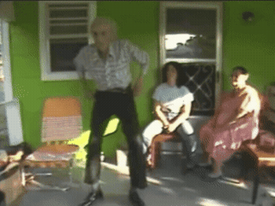 Man Dancing In Front Of Seated Crowd GIF
