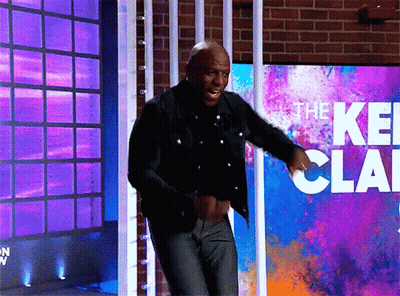 Man Dancing In Front Of The Keith Clark Sign GIF