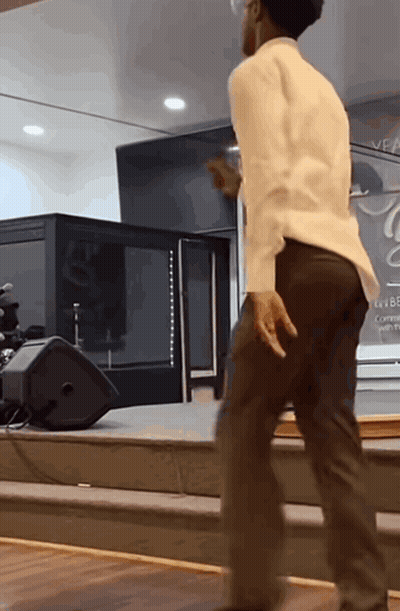 Man Dancing In Front Of Veal Sign GIF