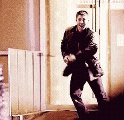 Man Dancing In Hallway In Front Of Door GIF