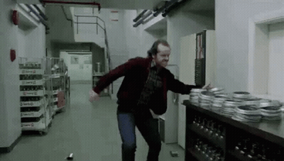 Man Dancing In Hallway In Front Of Film Reels GIF