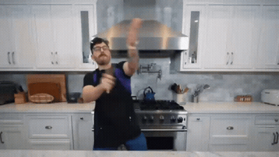 Man Dancing In Kitchen With Sword GIF
