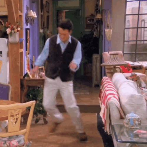 Man Dancing In Living Room With Couch GIF