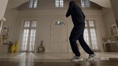 Man Dancing In Living Room With Starz Logo GIF