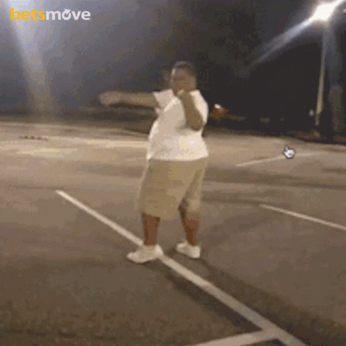 Man Dancing In Parking Lot With Betsmove Logo GIF