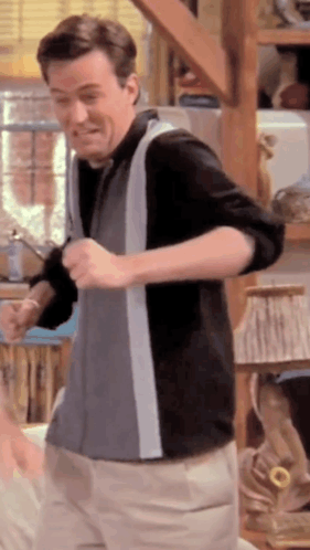 Man Dancing In Room With Lamp On Shelf GIF