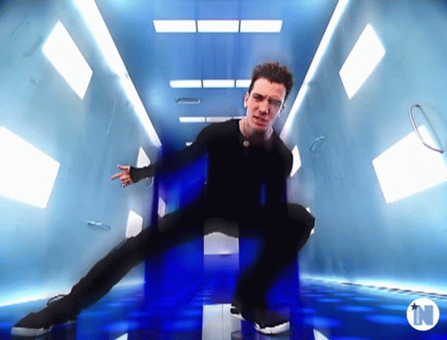 Man Dancing In Room With Letter N GIF