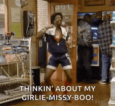 Man Dancing In Store On Cell Phone GIF