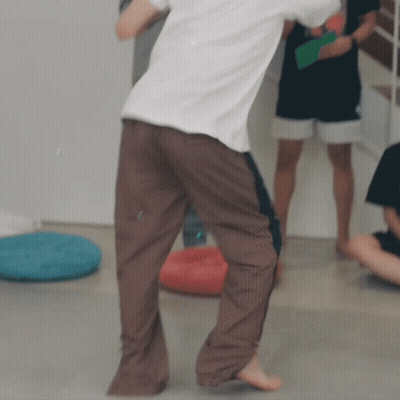 Man Dancing In White Shirt And Brown Pants GIF