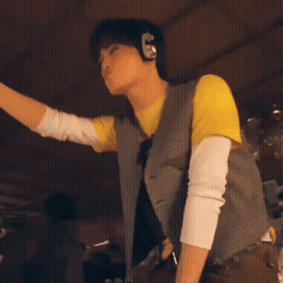 Man Dancing In Yellow Shirt And Brown Pants GIF