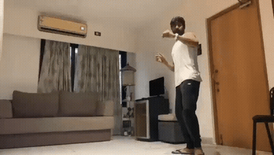 Man Dancing Living Room With Couch And Door GIF