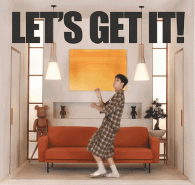 Man Dancing Near Orange Couch Let's Get It GIF