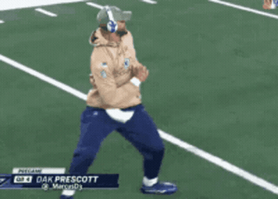 Man Dancing On Football Field With Headphones And Hat GIF