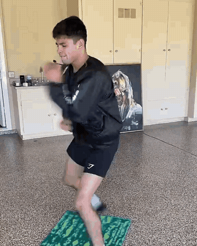 Man Dancing On Mat In Garage GIF