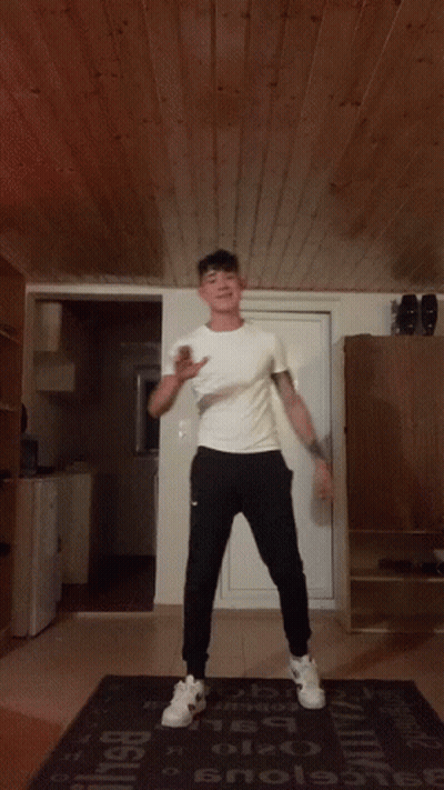 Man Dancing On Rug Saying Enola GIF