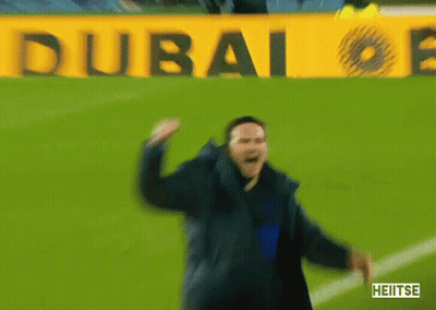Man Dancing On Soccer Field In Front Of Dubai Sign GIF