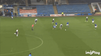 Man Dancing On Soccer Field In Front Of Dubai Sign GIF