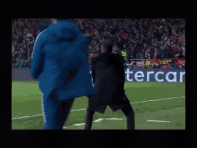 Man Dancing On Soccer Field In Front Of PS4 Logo GIF