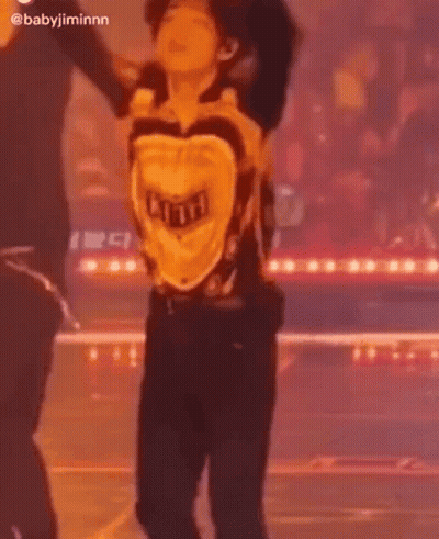 Man Dancing On Stage In Yellow Shirt GIF