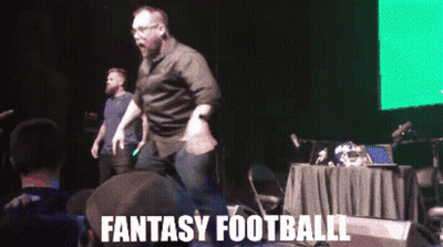 Man Dancing On Stage With Fantasy Football GIF