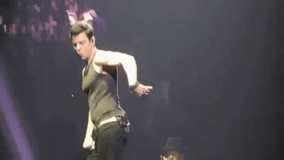 Man Dancing On Stage With Microphone GIF