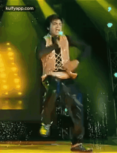 Man Dancing On Stage With Microphone GIF