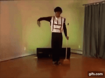 Man Dancing On Wooden Floor With Microphone GIF