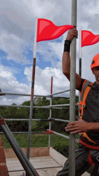 Man Dancing Red Flag Behind GIF