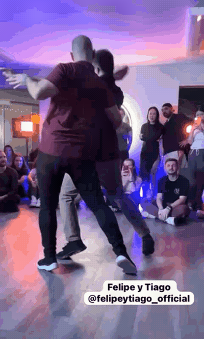 Man Dancing With Woman In Front Of Crowd GIF