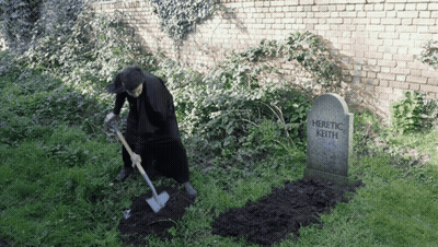 Man Digging At Heretic Keith Gravestone GIF