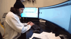 Man Distracted From Working GIF