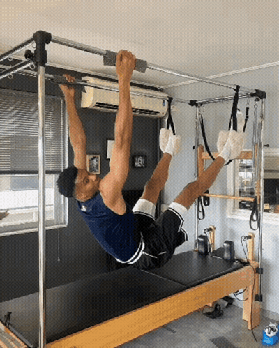 Man Doing Exercises On Pilates Machine GIF