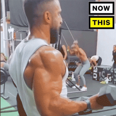 Man Doing Gym Exercises With Now This Sign GIF