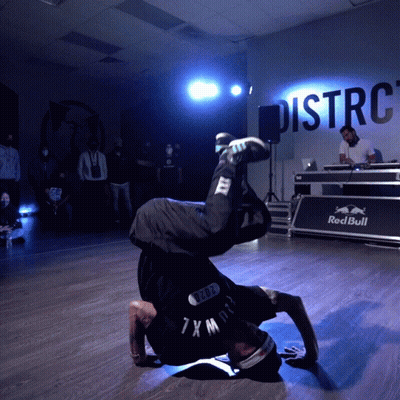Man Doing Handstand In Front Of Wall Saying Distrc GIF