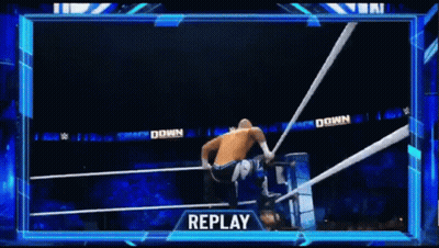 Man Doing Handstand In Wrestling Ring While Another Man Watches GIF