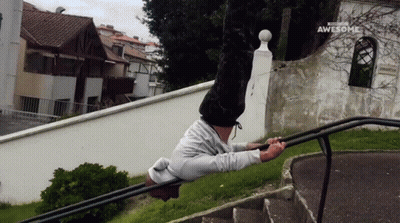 Man Doing Handstand On Railing Saying Awesome GIF