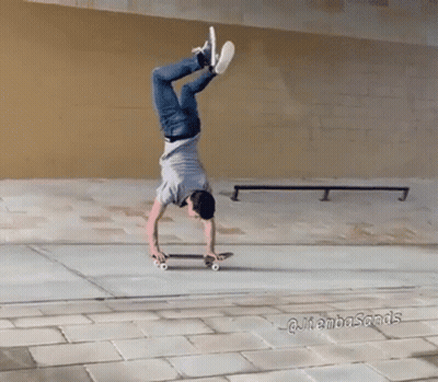 Man Doing Handstand On Skateboard In Front Of @Jambasands Sign GIF