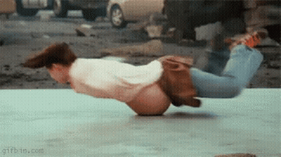 Man Doing Handstand With Car Background GIF