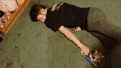 Man Doing Push Ups In Room With Stuffed Animals GIF
