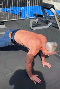 Man Doing Push Ups On Mat GIF