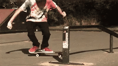 Man Doing Skateboard Trick on Railing