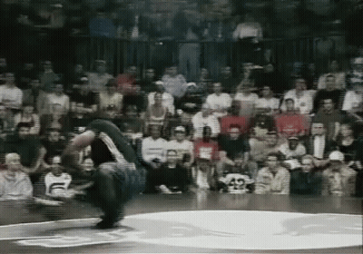 Man Doing Trick On Basketball Court In Front Of Crowd GIF