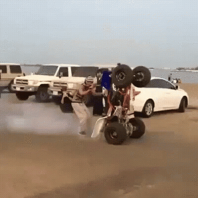 Man Doing Trick On Buggy In Sand GIF