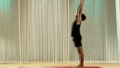 Man Doing Yoga Pose Arms Up GIF